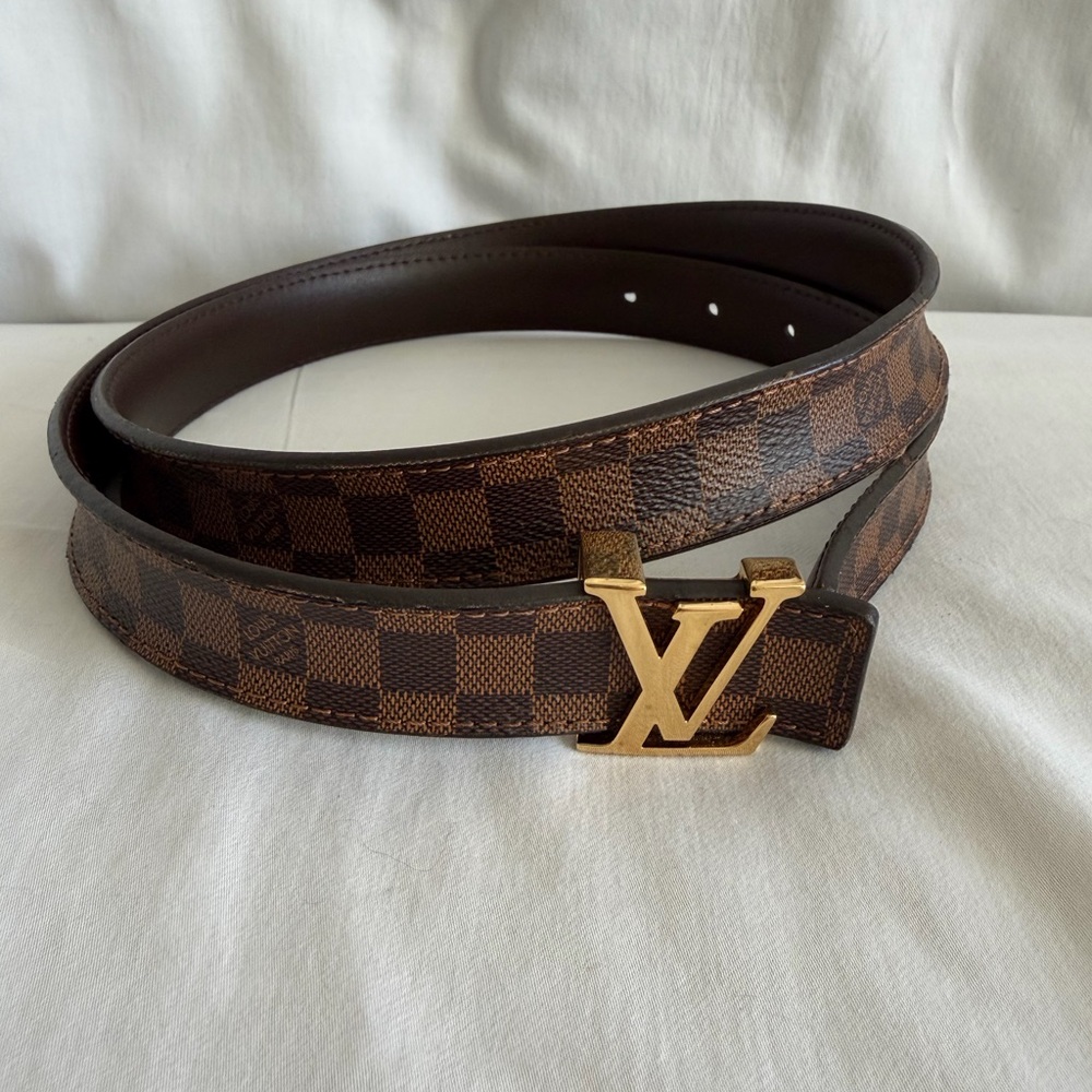 Louis Vuitton women’s Damier Ebene Belt with Gold LV Buckle.